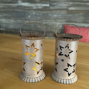 Two metal star cut out candleholders
